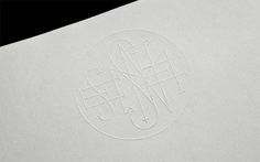 Nemesis Films #emboss #stamp #lettering #white #anagrama #monogram #logo