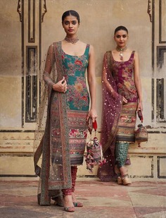 Discover Sabyasachi's latest winter bridal collection, featuring exquisite floral designs on this stunning bridal suit, blending international styling with an Indian soul.