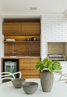 Airy Apartment Interior by Diego Revollo in main interior designCategory #interior #brick #white #vessels #kitchen #ceramic