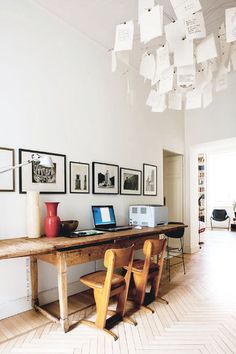 What appears like a very old desk outfitted with some modern amenities. #desk