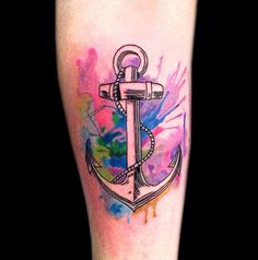 A beautiful watercolor tattoo design featuring an anchor, blending traditional tattoo art with modern watercolor techniques.