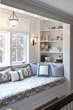 Make a Reading Nook With Shelving on Your Bay Window Seating.