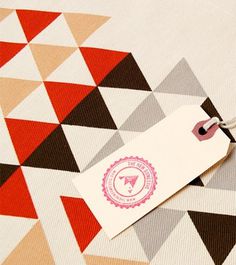 Design*Sponge | Your home for all things Design. Home Tours, DIY Project, City Guides, Shopping Guides, Before & Afters and much more #stamp #retro #tag #colors #triangles #bag #hand
