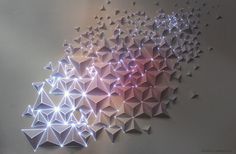 Paper, tape, light.Video projection onto origami. #paper #origami #light