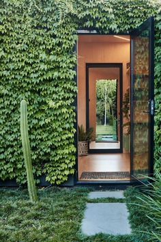 Writer's Shed by Matt Gibson is a Melbourne garden studio covered in ivy