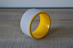 Concrete on wooden bangle in grey and yellow by cementology #bangle #wood #yellow #concrete