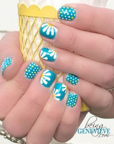 Polka dots and daisy petals nail art