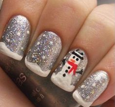 Snowman inspired Christmas nail art. Recreate the snowman and the snow with this nail art reference. Make use of a combination of nail polis