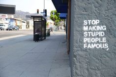 this isn't happiness™ photo caption contains external link #text #street #stencil #sentence #stupid #art #stop #fame