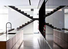 Party House Project by Pitsou Kedem Architects kitchen stylish black gray base #stairs #staircase #kitchen #design