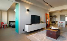 Minimally Designed Apartment With Punches of Color Photo #interior #design #decor #deco #tv #decoration