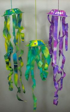Create the jelly fish craft with paper, google eyes and paper bowls. Hang them up on a windy day and watch their tentacles flutter as if the #diy #fish #sea