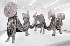 Speak Louder: Nick Cave is an artist who makes costumes for sculpture. Actually, the costumes are the sculptures. #nick #performance #sculpture #center #cave #of #at #meet #me #the #earth #soundsuits #art