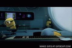 An animated movie scene featuring two yellow minions, showcasing their cute antics in a banana-themed setting.