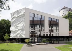 Metaphor for the Uprising Generation: School Extension Integrating a Crinkled Wall #school #architecture