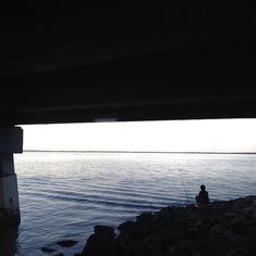 The lone fisher. #water #fisher #lone #bridge #alone #fishing