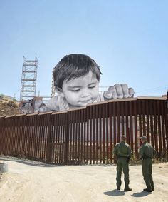 A Child Peers Over the US/Mexico Border Wall in a Giant New Photographic Work by JR