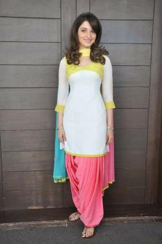 Tamanna Bhatia shines in this stunning simple Patiala suit design, featuring intricate neck details, laces, and a heavy dupatta, perfect for any Punjabi wedding or celebration.