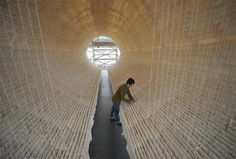 A Suspended Boat of 8,000 Sheets of Rice Paper Draped on Bamboo by Zhu Jinshi #tube #installation