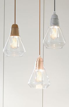 Ando 1 light pendant with cork, copper or concrete lampholder and glass shade.
