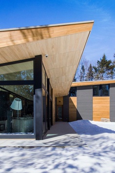 Wooden Wing Cottage in Quebec Perched on a Granite Bedrock 2
