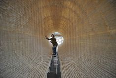 A Suspended Boat of 8,000 Sheets of Rice Paper Draped on Bamboo by Zhu Jinshi #tube #installation