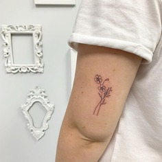 Minimal Elbow Flower Tattoo