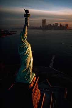 The Statue of Liberty hails dawn over New York Harbor in 1978.Photograph by David Alan Harvey, National Geographic Creative #statue #of #liberty