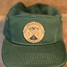 rainydaysandblankets: coldwindandiron: saltandsteel: 5 Panel || Camp Hats are online now. Very limited quantity so get them while they la #logo #mountains #hat #typography