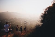 A group of friends hiking during sunrise or sunset in Los Angeles