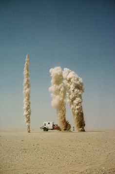 Geysers of sand explode as geologists probe for oil bearing land in Saudi Arabia, January 1966.Photograph by Thomas J. Abercrombie, National #nat #nature #vintage #film #geysers #oil