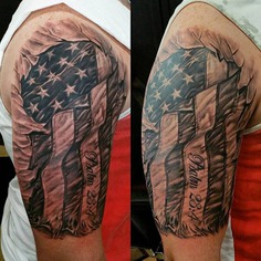 A striking right shoulder tattoo featuring an American flag design, symbolizing patriotism and national pride.