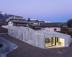 Massive Concrete Family House with Generous Inner Apertures to the Light