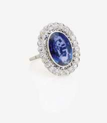 ENTOURAGE RING DECORATED WITH A SAPPHIRE AND DIAMONDS