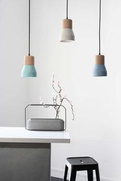 Cement Wood Lamps: Beech wood and colored cement pendant lamps by Decha Archjananun/Ecal