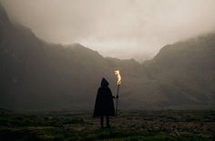 Sleepless Dreams | untrustyou: Oscar Zabala #mysterious #torch #mist #photography #fire #figure #valley #hood #mountains