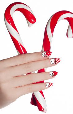 Check out this amazing Christmas Hello Kitty inspired nails. Coated in bright red nail polish, you can see Hello Kitty's face peeking out