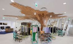 A unique retail design concept by Paul Coudamy, featuring a fantastical canopy made from laminate, showcased in Tokyo.