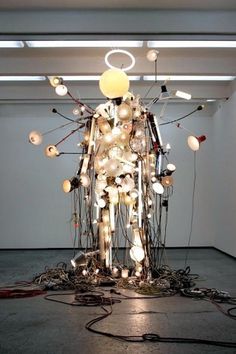 Electric Man | Colossal #bulb #bright #sculpture #electric #shine #halo #man #light #cable #electronic