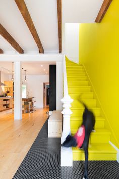 HISTORICAL ROW HOUSE GETS A WHIMSICAL, INDUSTRIAL RENOVATION