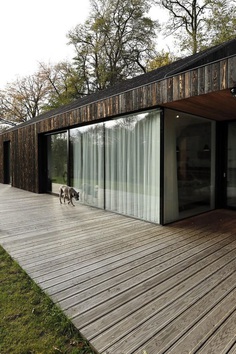 One-Story Family House Covered with Charred Larch Planks 2