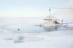 Winter Swimming in The Frozen Lake by Markku Lahdesmaki