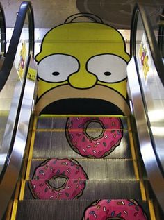 homer eats some donuts on the escalator - technabob #simpsons