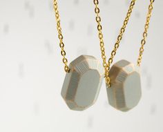 wood Diamond. geometric necklace. concrete grey faceted pendant on gold tone chain. Handcrafted wooden gemstone. #jewellery