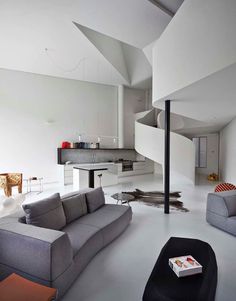Dramatic Loft Apartment with Curvalicious White Interior