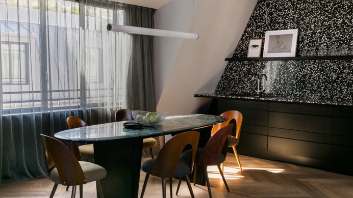 The penthouse, with a dining area and top-floor light.
