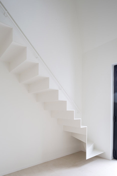 Delicate staircase leads to attic extension by Five AM