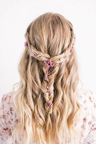 We've assembled a gorgeous collection of wedding hairdos for long hair including chignons, waterfall braids, classic half-up, half-down styles, fishtails, flower crowns, buns, updos and ponytails, and some hairstyle options for curly or wavy hair.