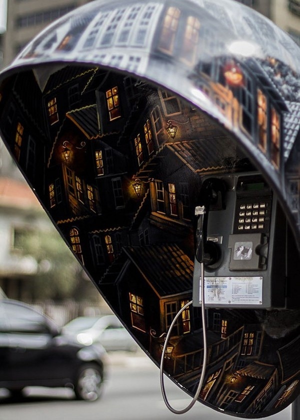 Interior of creative phone booth with town inside painted #phone #public #booth #art #street #exterior #telephone