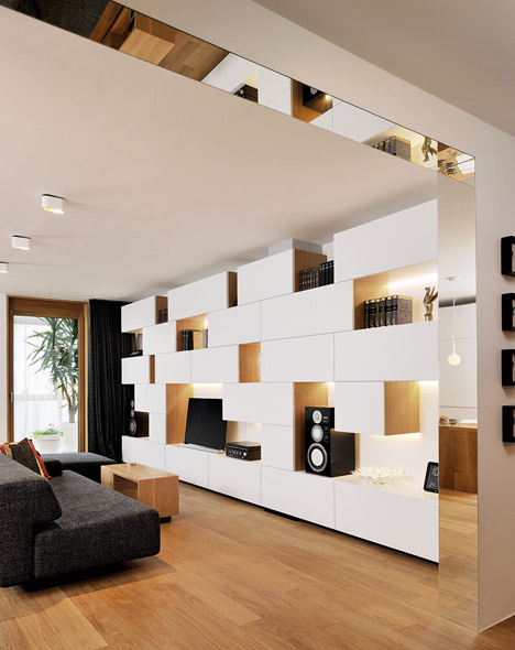Studio 360 adds walls of modular shelving and storage to Slovenian apartment #interior